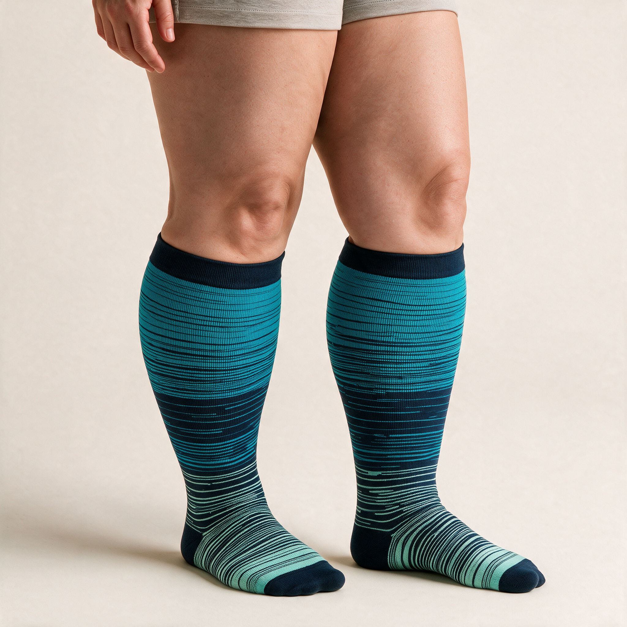 Clinical Compression – Wide Calf: Teal Fade Lines compression sock worn on model